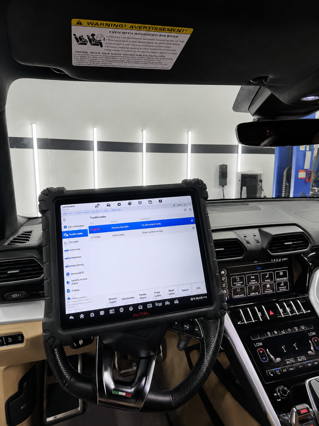 CarLogic Exotic technician running a factory-level diagnostic scan inside a Lamborghini Urus